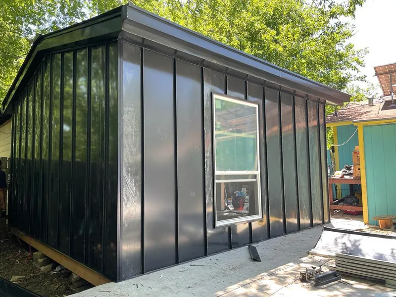 Black standing seam metal wall panels for Metal Roof Installation in Shirley